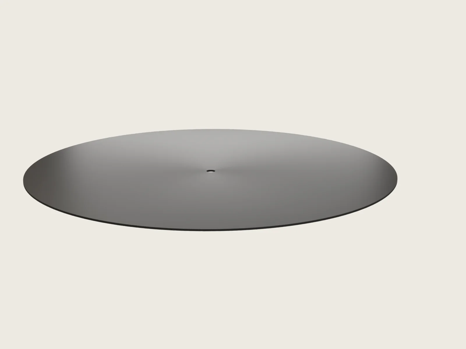 Sheet-cut disc seen from three quarters: a perfectly flat black round with a sharp, square-cut edge